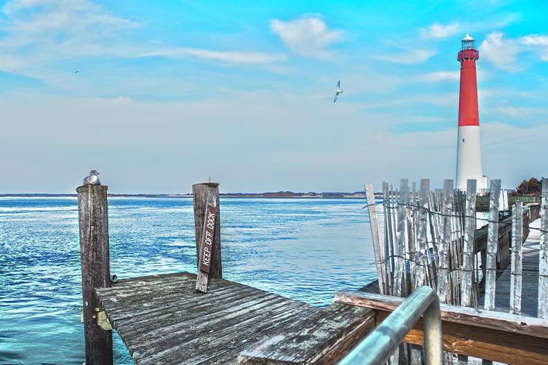 Photo of a dock and red lighthouse on the Atlantic Coast in Ocean County, New Jersey