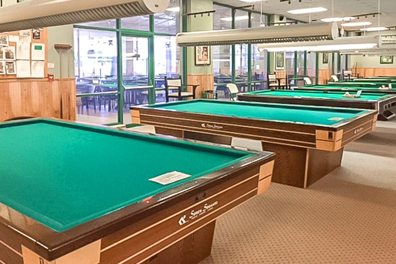 Pool tables in an amenity center at Wynmoor Village in Coconut Creek, Florida